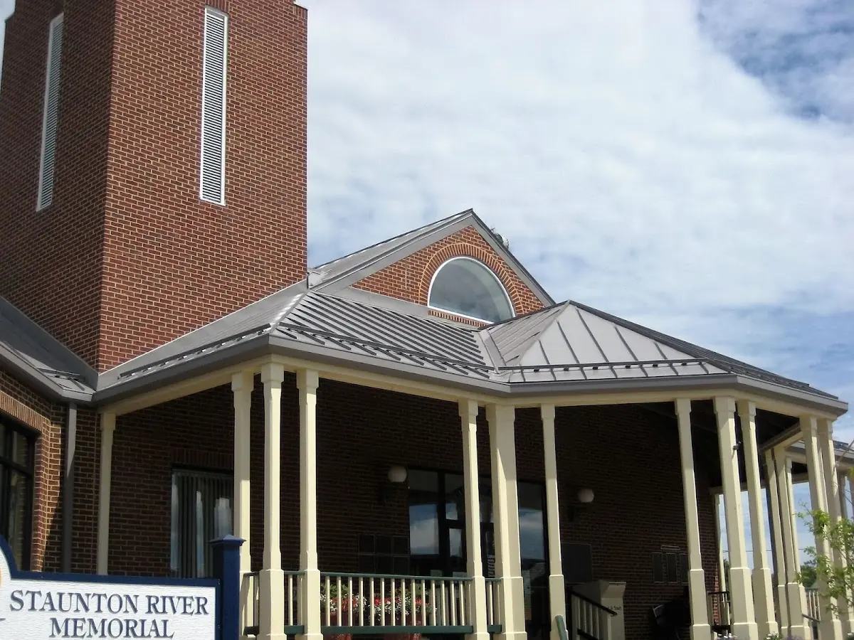 Skilled roofing craftsmen working on a residential roof in Stoneleigh - Dellcrest